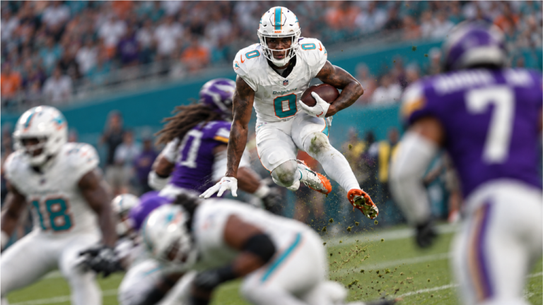 Miami Dolphins running back Ollie Gordon II carries the ball against the Minnesota Vikings.