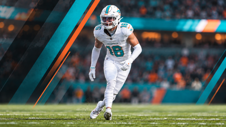 Miami Dolphins safety Michael Taaffe in a white No. 16 uniform against a blurred stadium background