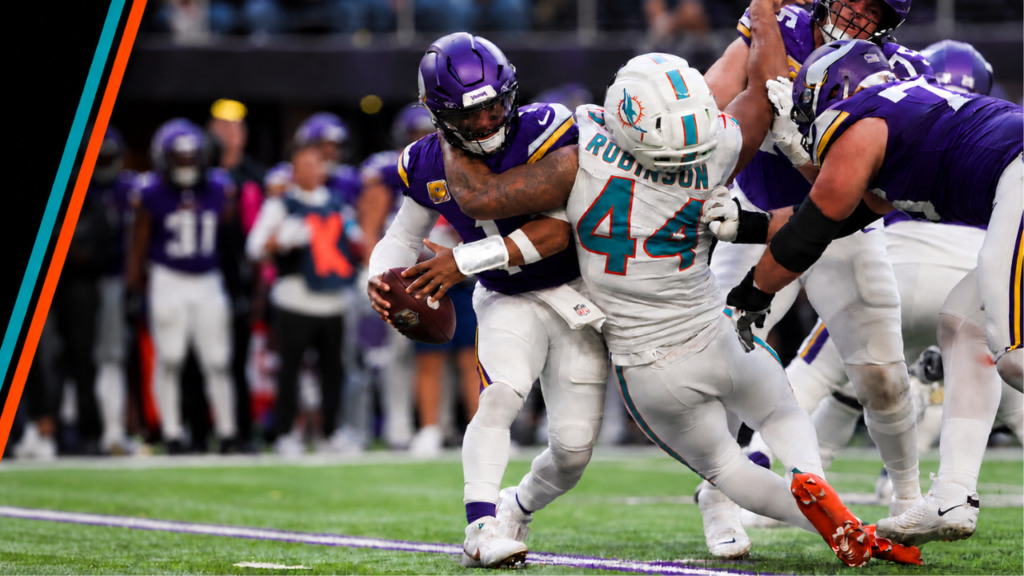 Miami Dolphins linebacker Chop Robinson pressures the Minnesota Vikings quarterback.